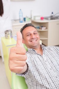 A man showing thumbs up for successful procedure