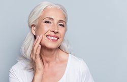 An old beautiful woman with Dental implants